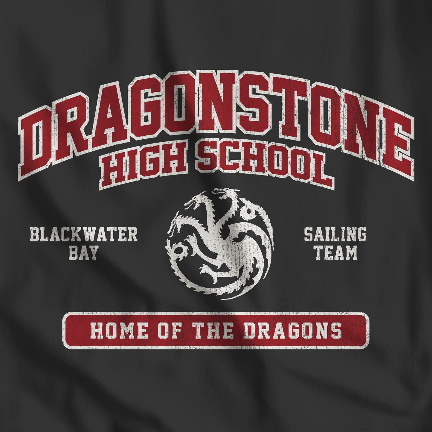 Closeup of vintage black Dragonstone High School t-shirt with distressed three-headed dragon graphic inspired by Game of Thrones and the Targaryens