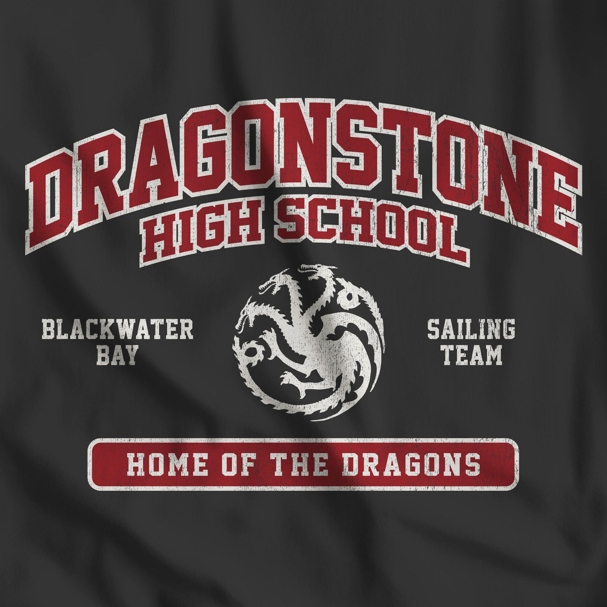 Closeup of vintage black Dragonstone High School t-shirt with distressed three-headed dragon graphic inspired by Game of Thrones and the Targaryens