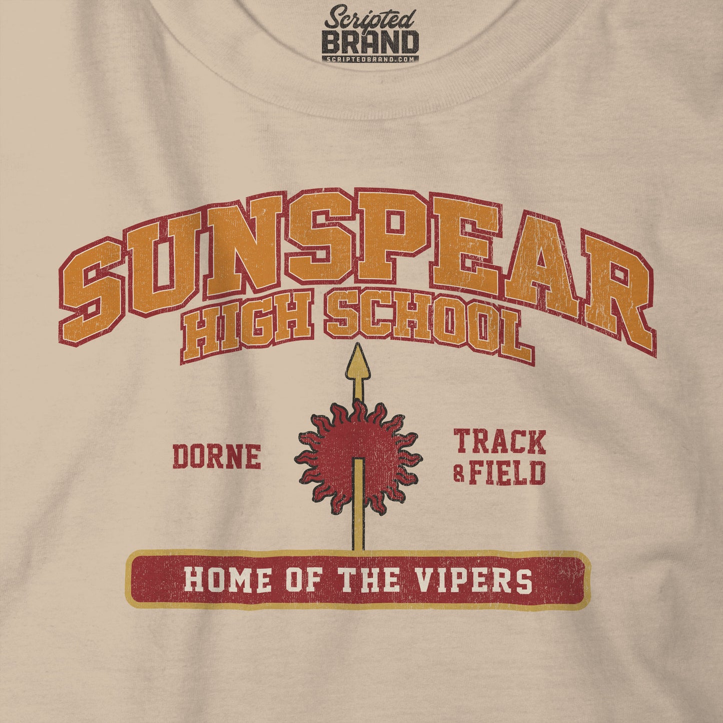 Closeup view of tan Sunspear High School t-shirt with distressed dorne sun graphic inspired by Game of Thrones.