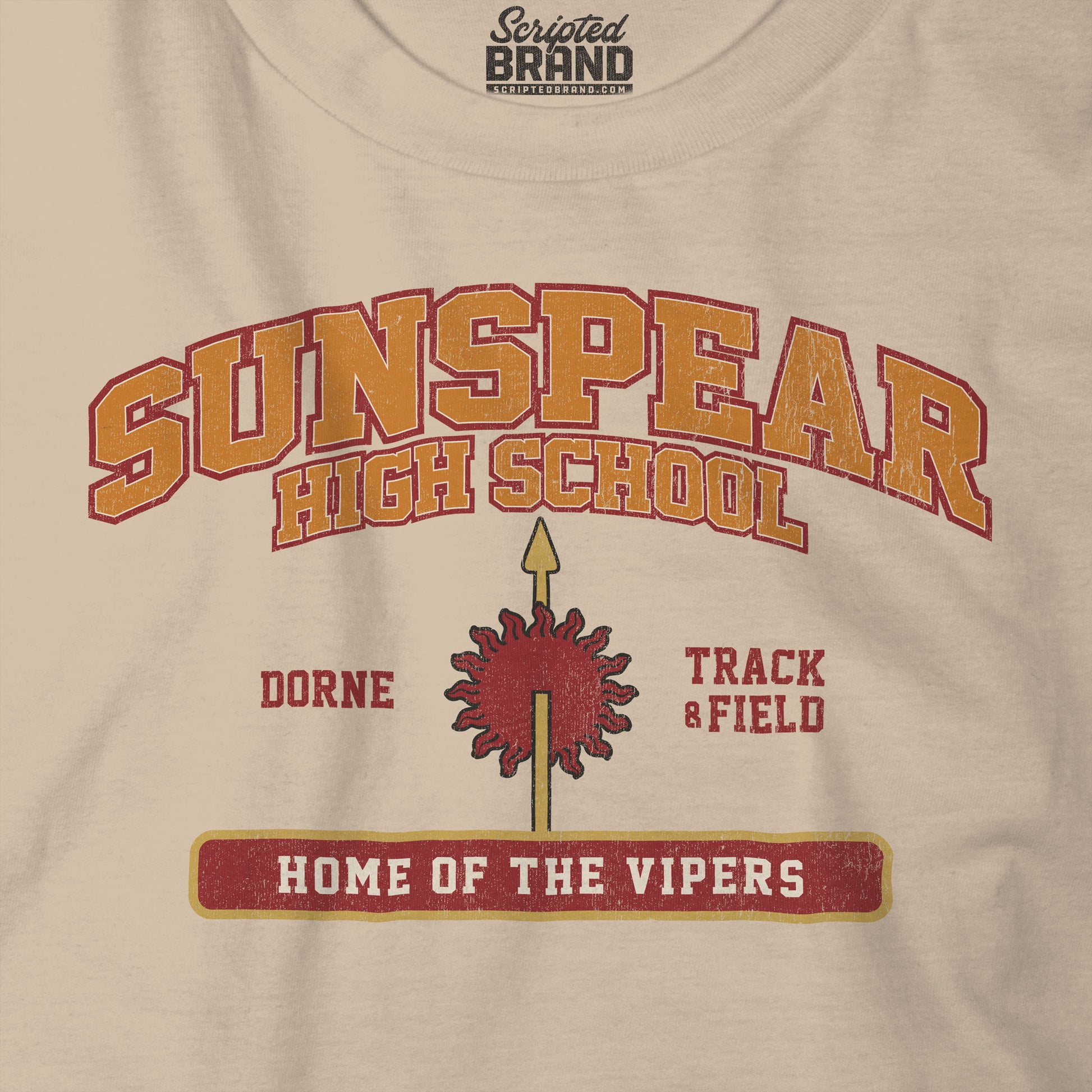 Closeup view of tan Sunspear High School t-shirt with distressed dorne sun graphic inspired by Game of Thrones.