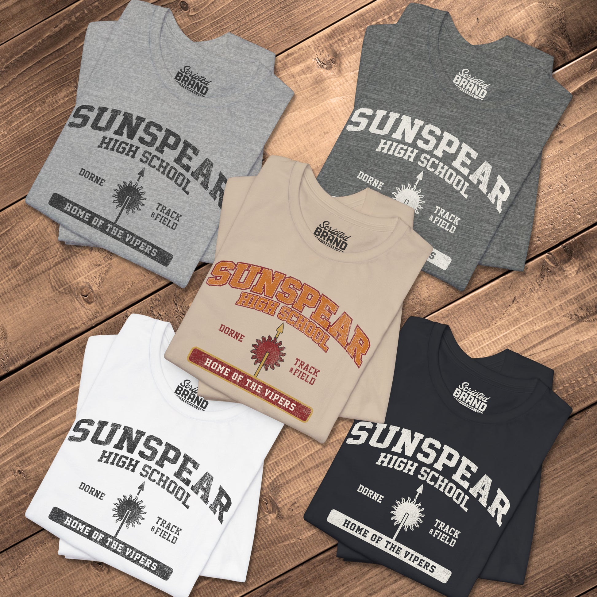 Five folded Sunspear High School t-shirts with distressed dorne sun graphic inspired by Game of Thrones.