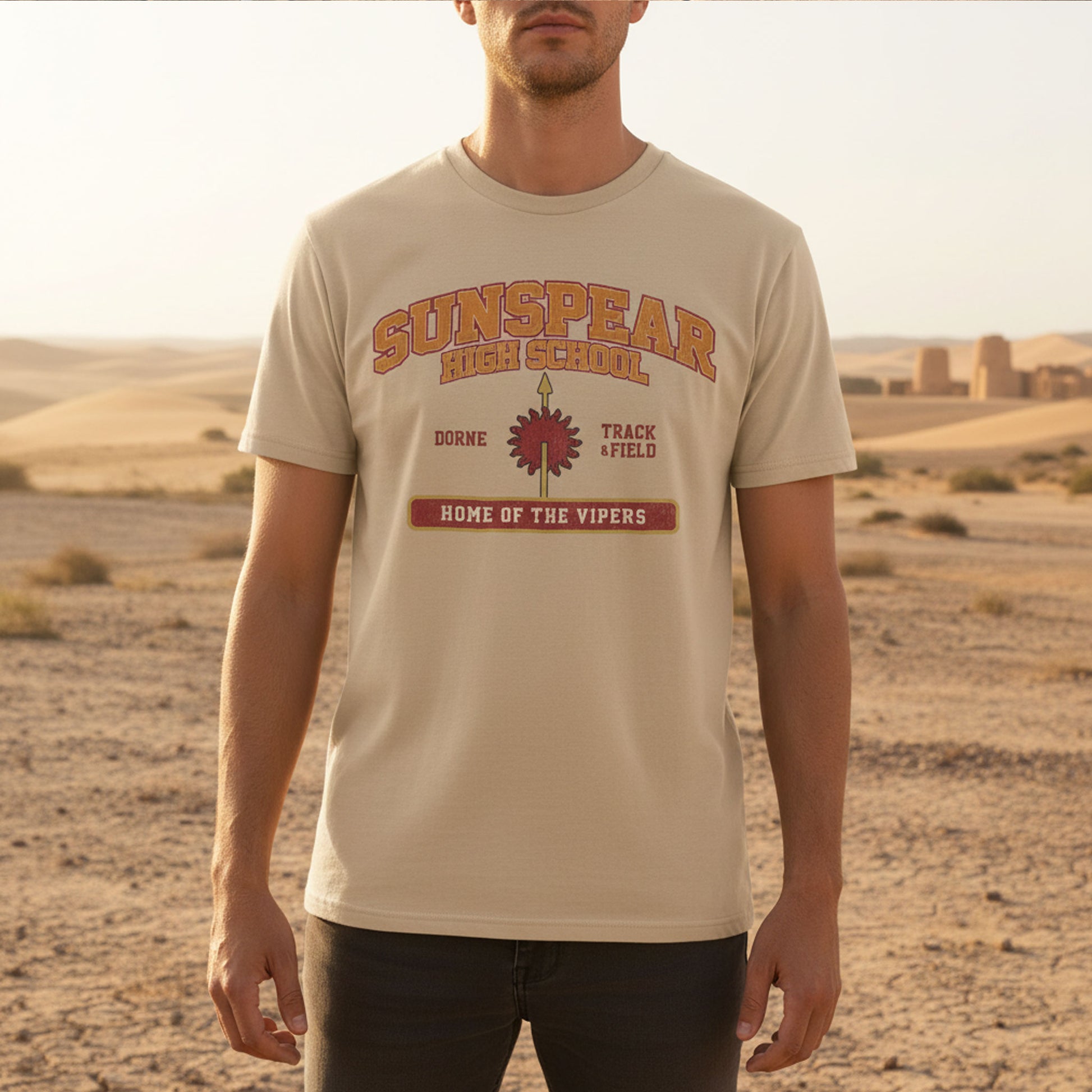 Person wearing tan Sunspear High School t-shirt with distressed dorne sun graphic inspired by Game of Thrones in a desert.