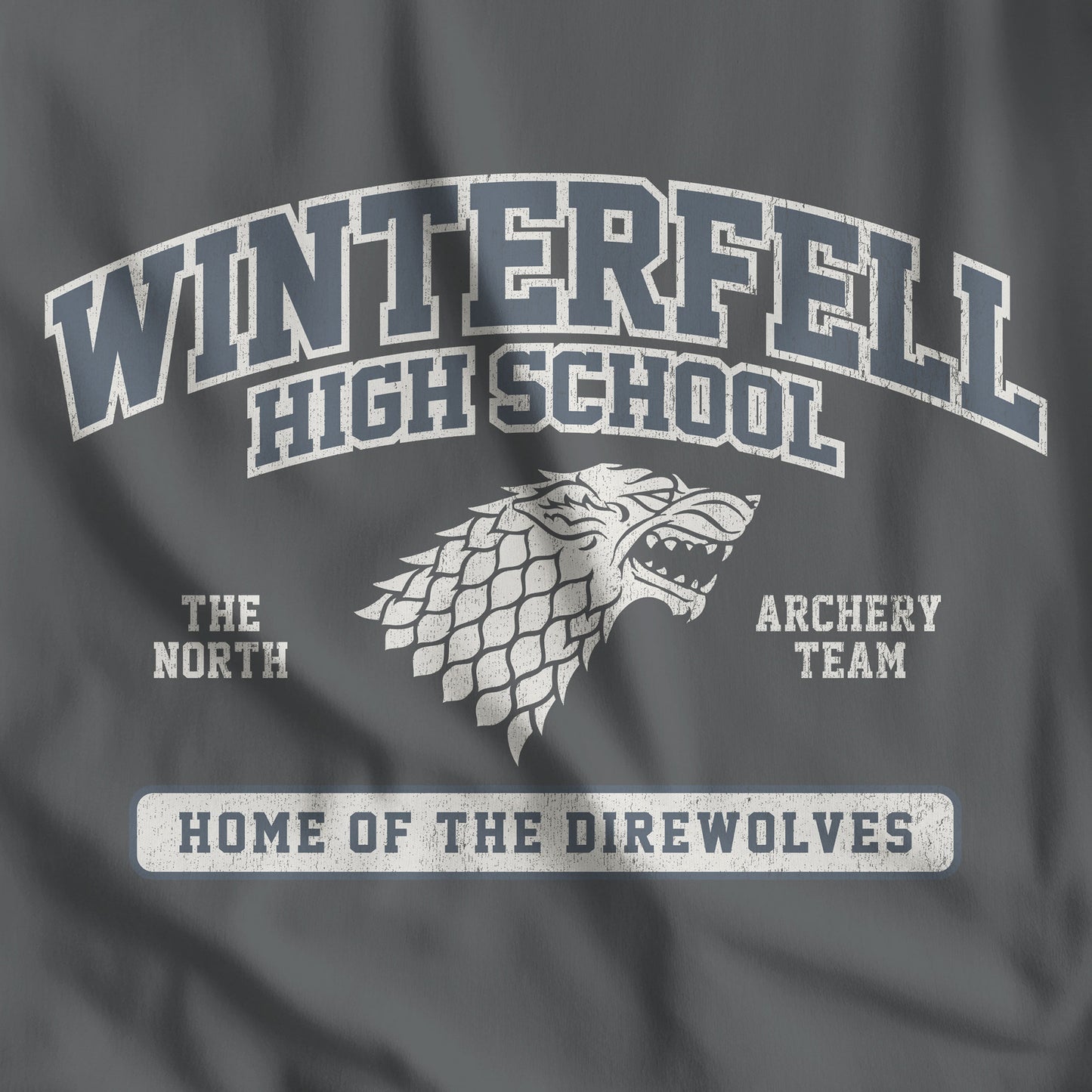 Closeup of Asphalt Dark Gray Winterfell High School t-shirt with vintage direwolf graphic inspired by Game of Thrones
