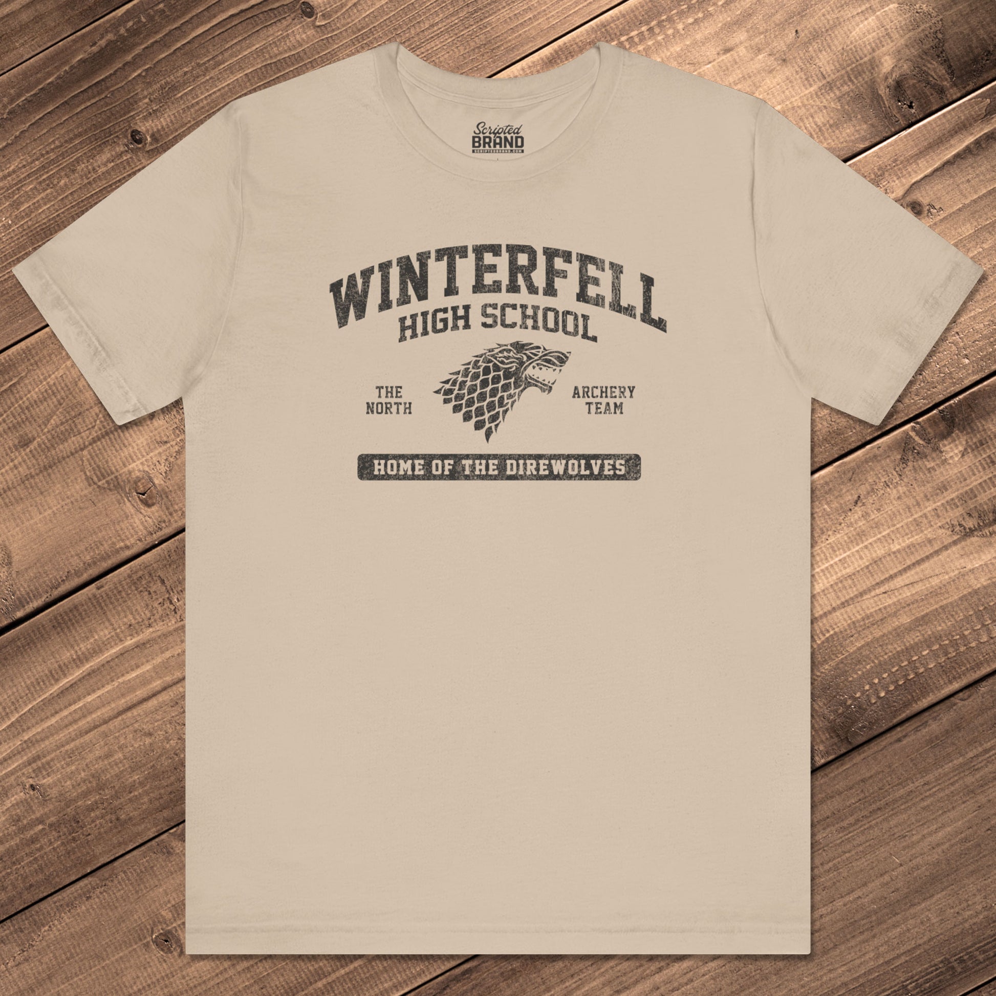 Front view of Tan Winterfell High School t-shirt with vintage direwolf graphic inspired by Game of Thrones.
