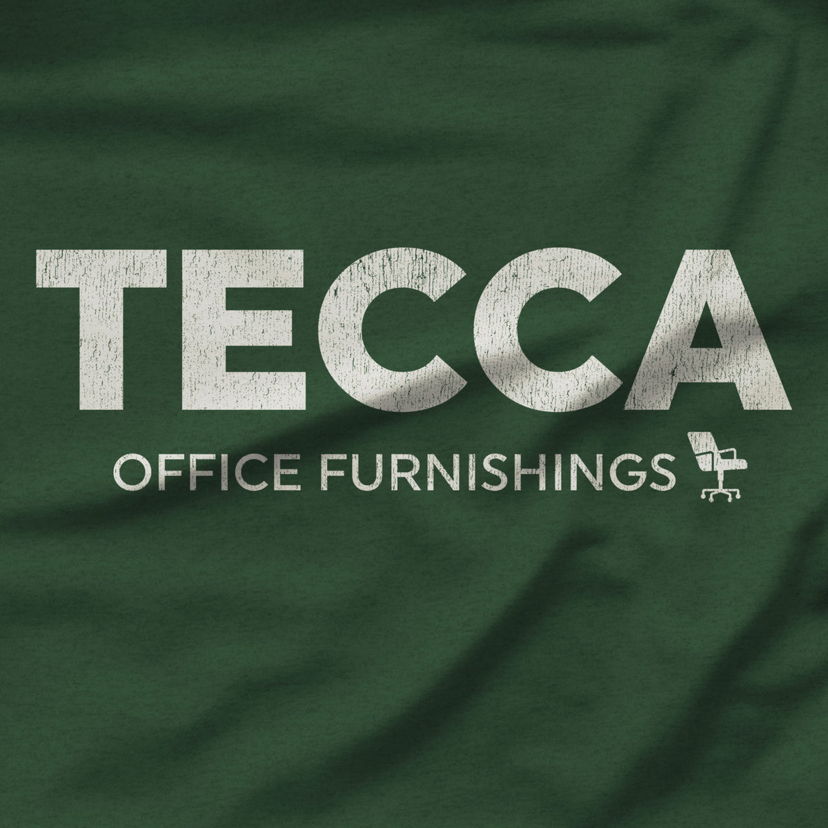 Closeup of Heather forest green TECCA Office Furnishings tee inspired by The Chair Company. Bella+Canvas tim robinson shirt comedy.