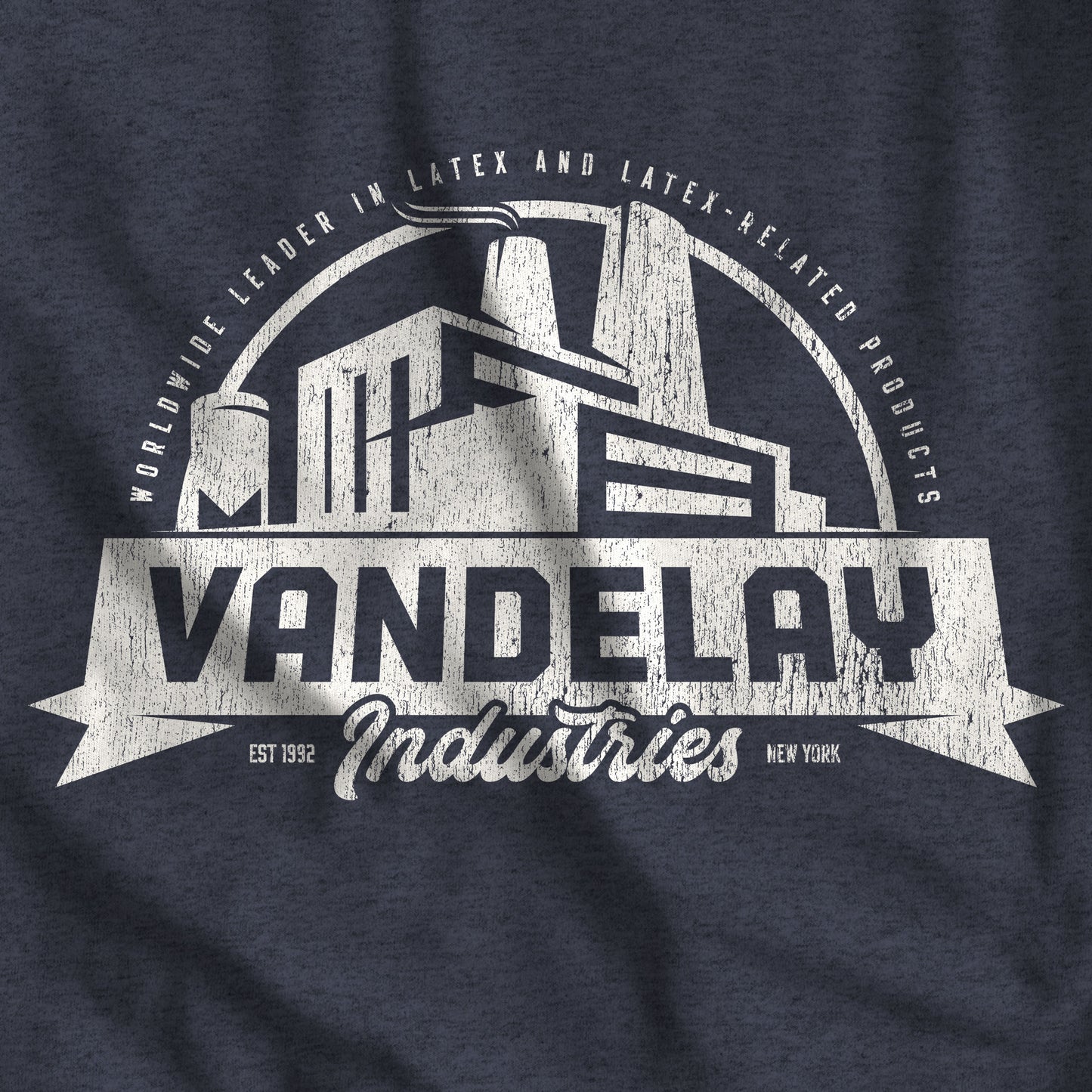 Closeup of Heather Navy Blue Bella+Canvas 3001 t-shirt with a Vandelay Industries logo that George Costanza made up in the TV Show Seinfeld.