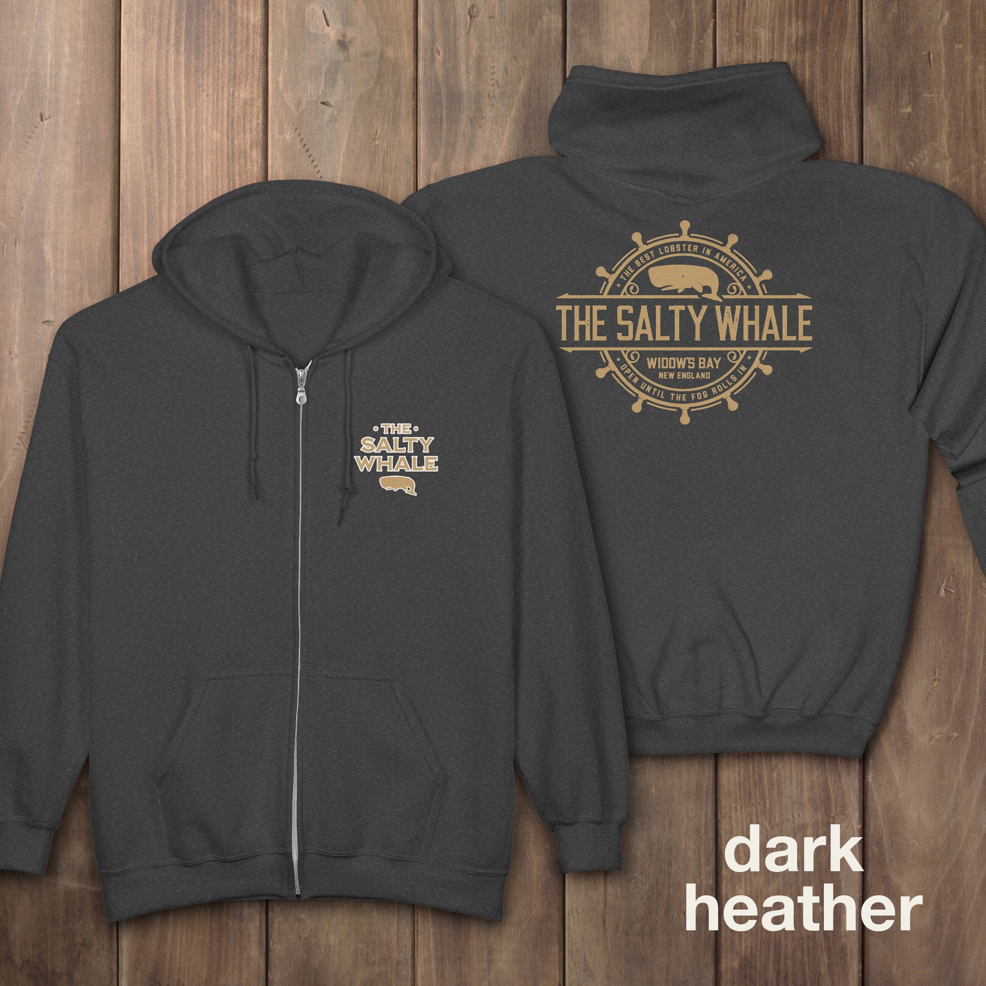 Dark heather gray Gildan full-zip hoodie with Widow's Bay Salty Whale logo on front and gold distressed maritime crest across the back