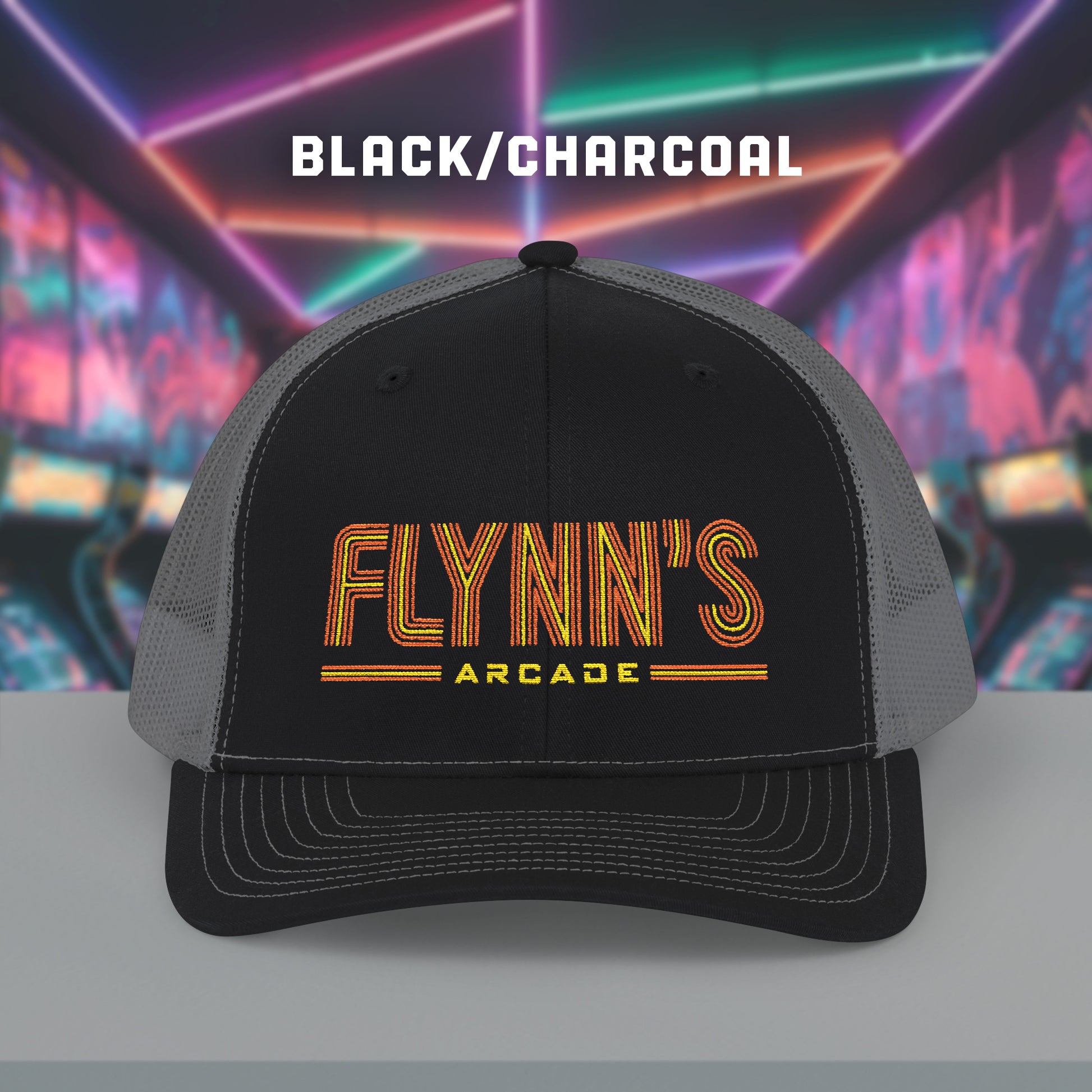 Front view of Black and charcoal Richardson 112 snapback trucker cap with 'Flynn’s Arcade' neon logo inspired by TRON.