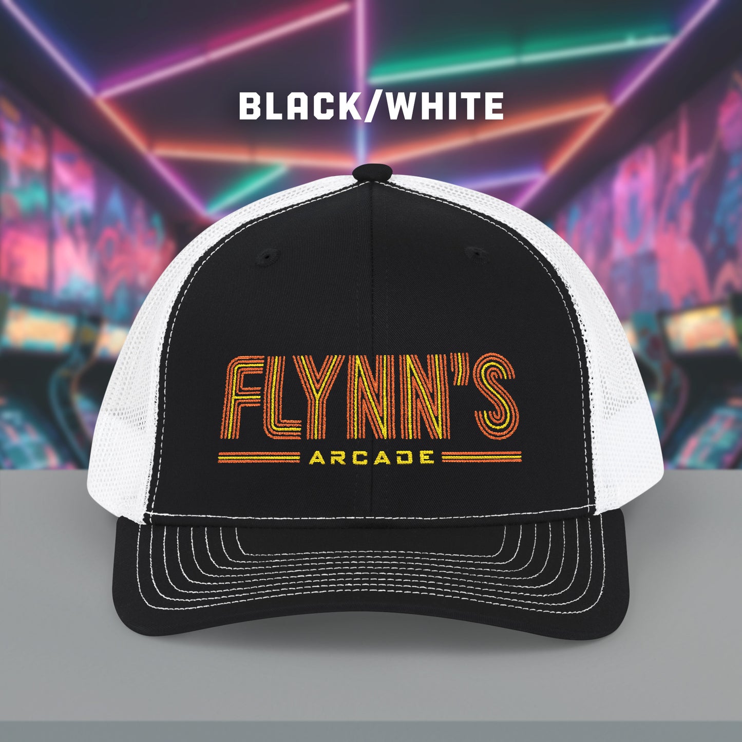 Front view of Black and white Richardson 112 snapback trucker cap with 'Flynn’s Arcade' neon logo inspired by TRON.