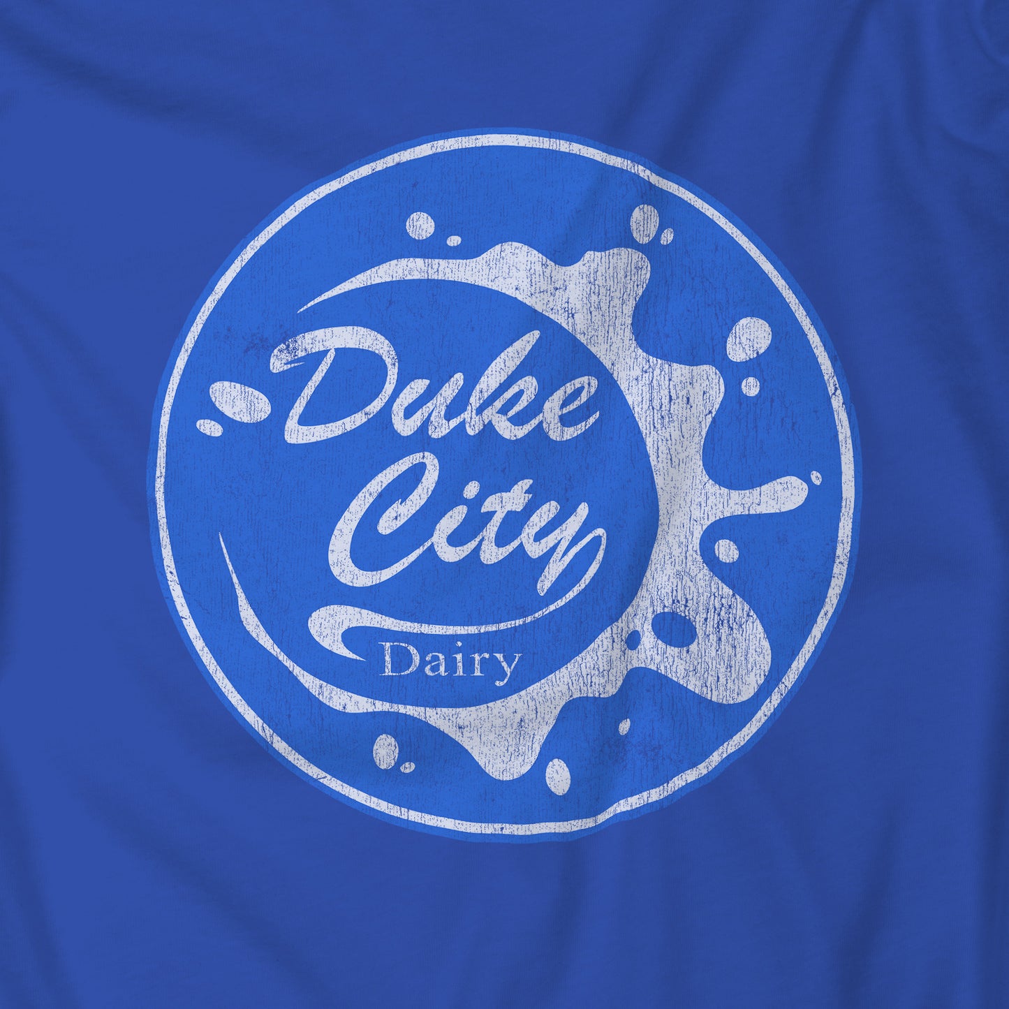 Closeup of blue hoodie with 'Duke City Dairy' logo from Pluribus