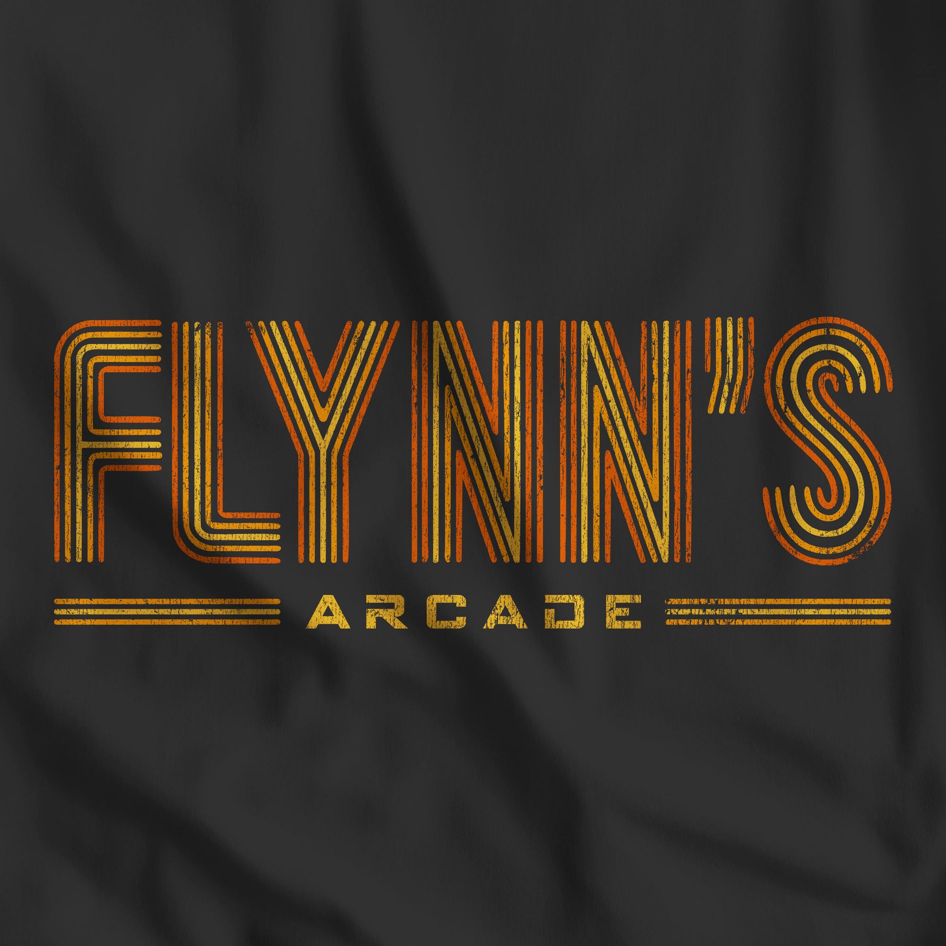 Closeup of black tee with vintage distressed 'Flynn’s Arcade' neon sign logo inspired by TRON, unisex fit t-shirt