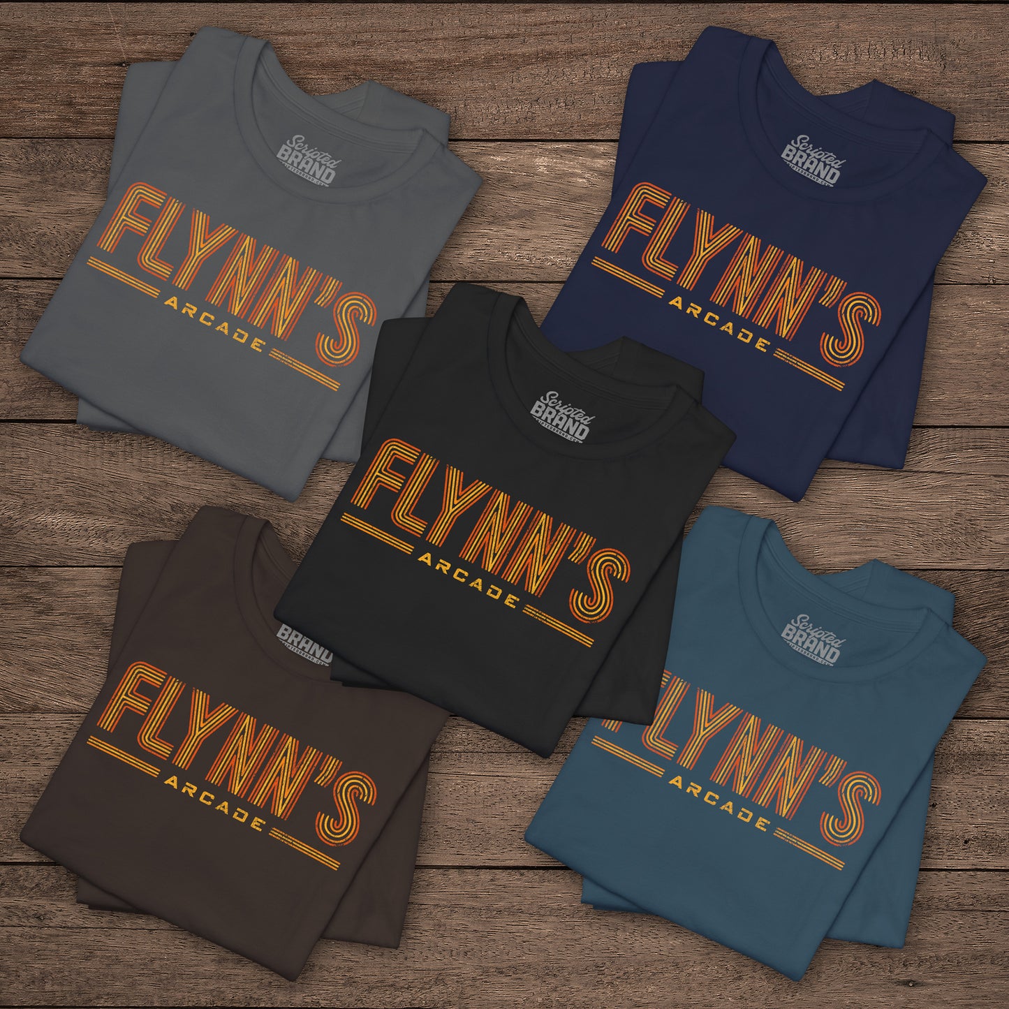 Five folded t-shirts with vintage distressed 'Flynn’s Arcade' neon sign logo inspired by TRON, unisex fit