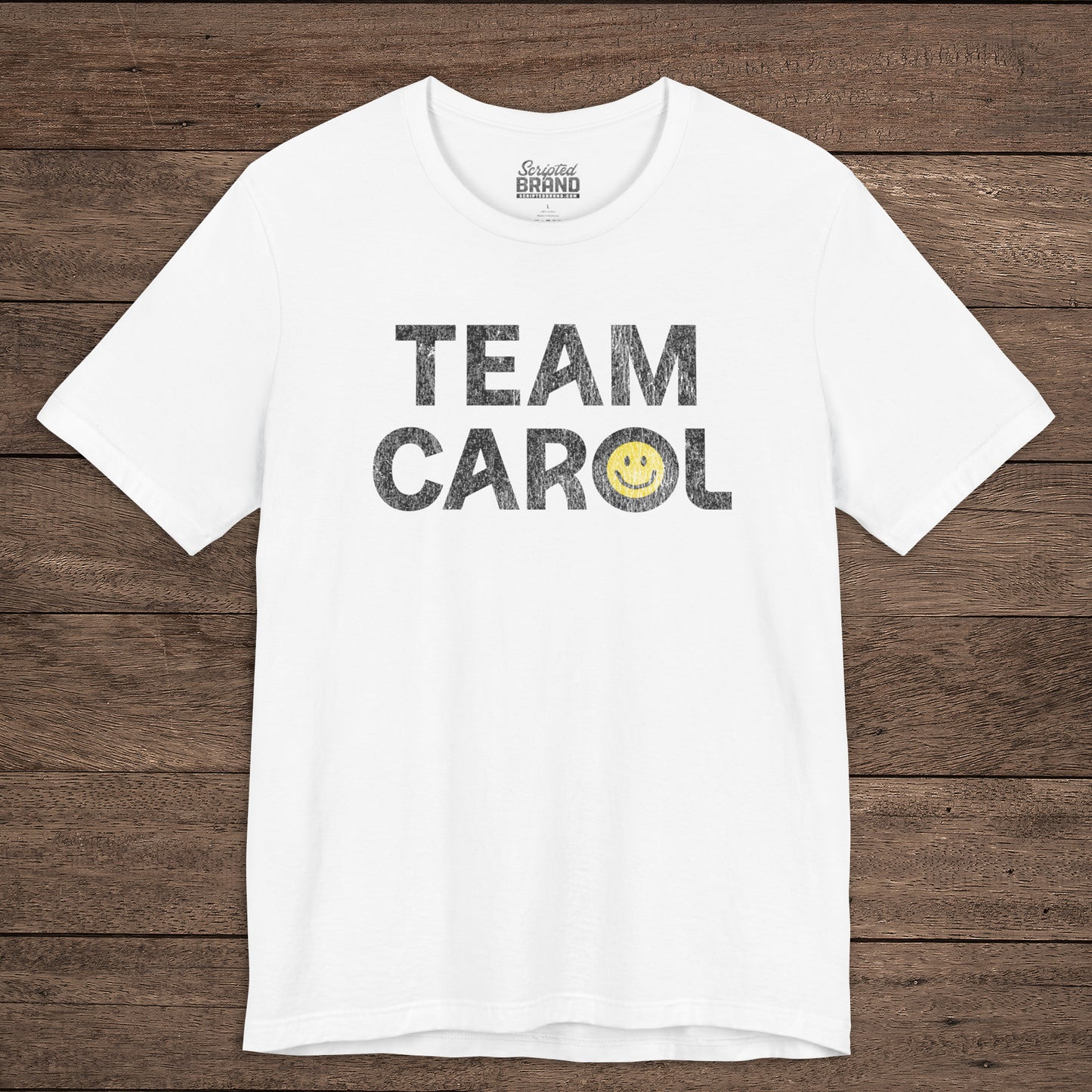 Front view of white TEAM CAROL t-shirt inspired by Pluribus with vintage distressed smiley face graphic