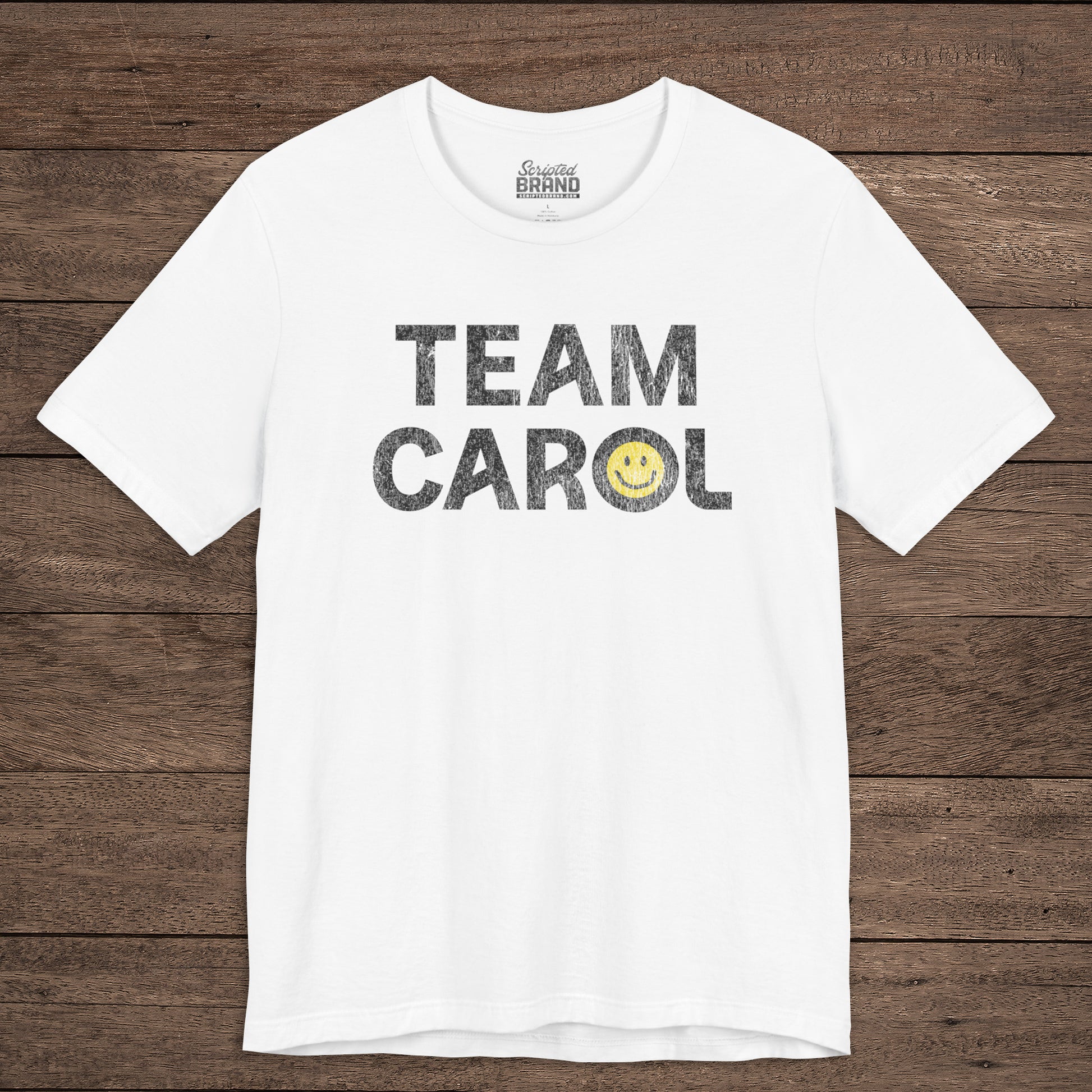 Front view of white TEAM CAROL t-shirt inspired by Pluribus with vintage distressed smiley face graphic
