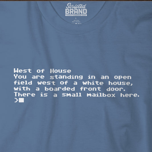 Closeup of blue Bella+Canvas 3001 Zork “West of House” text adventure quote t-shirt with terminal-style printed text
