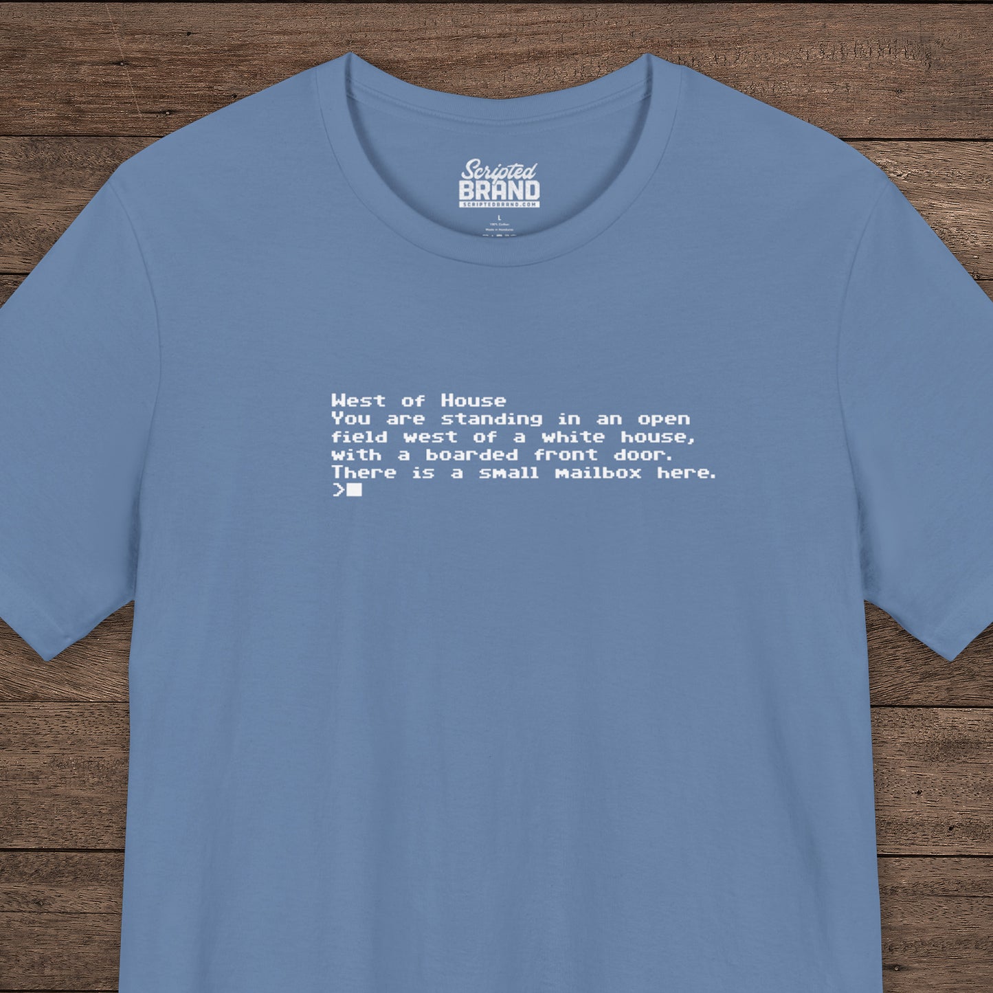 Blue Bella+Canvas 3001 Zork “West of House” text adventure quote t-shirt with terminal-style printed text