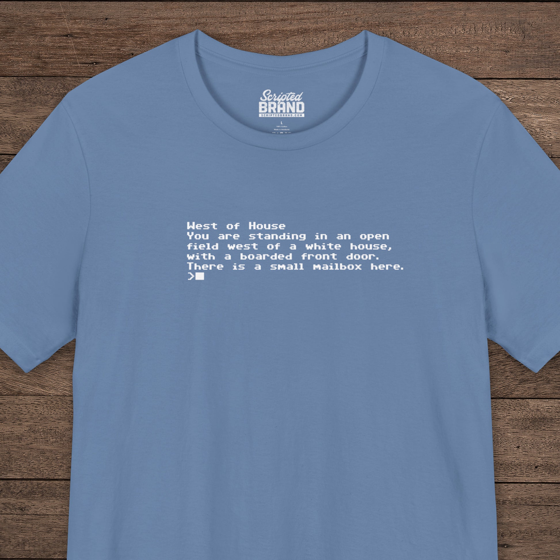 Blue Bella+Canvas 3001 Zork “West of House” text adventure quote t-shirt with terminal-style printed text