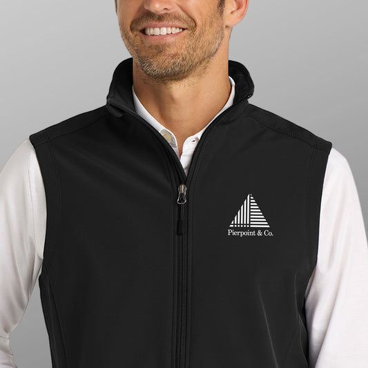 Closeup of man wearing black Port Authority J325 soft shell vest with white Pierpoint & Co logo embroidery, inspired by Industry.