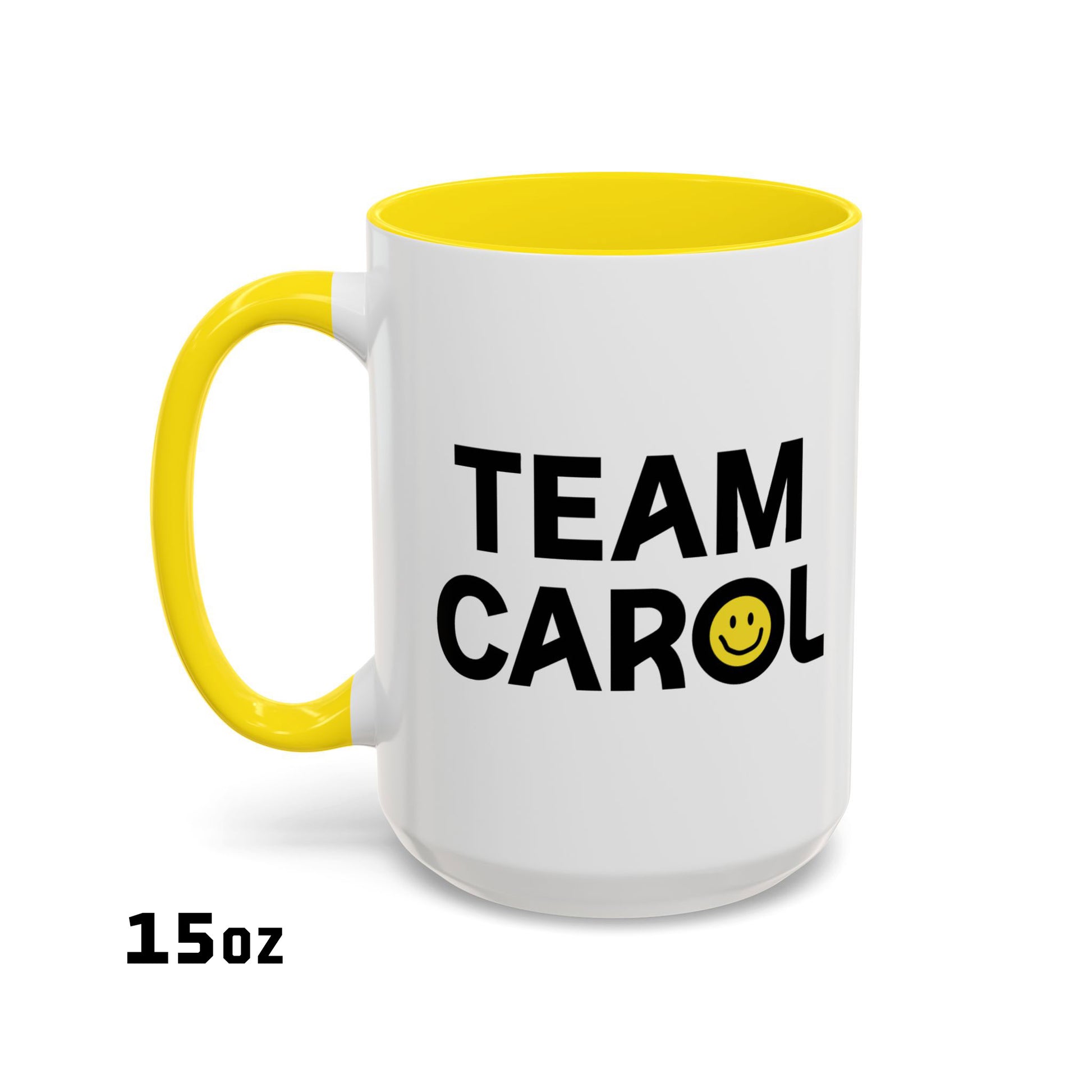 15 oz ceramic accent mug with yellow handle and interior, TEAM CAROL text and smiley face from Pluribus, shown on white background