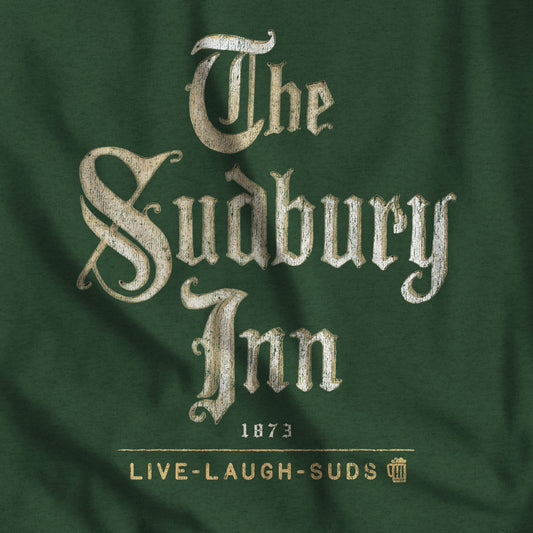 Closeup of Heather forest green tee with vintage distressed The Sudbury Inn 1873 Live Laugh Suds Bethel Maine design