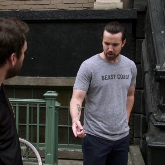 Mac wearing Athletic Heather t-shirt with vintage BEAST COAST text in It’s Always Sunny in Philadelphia.