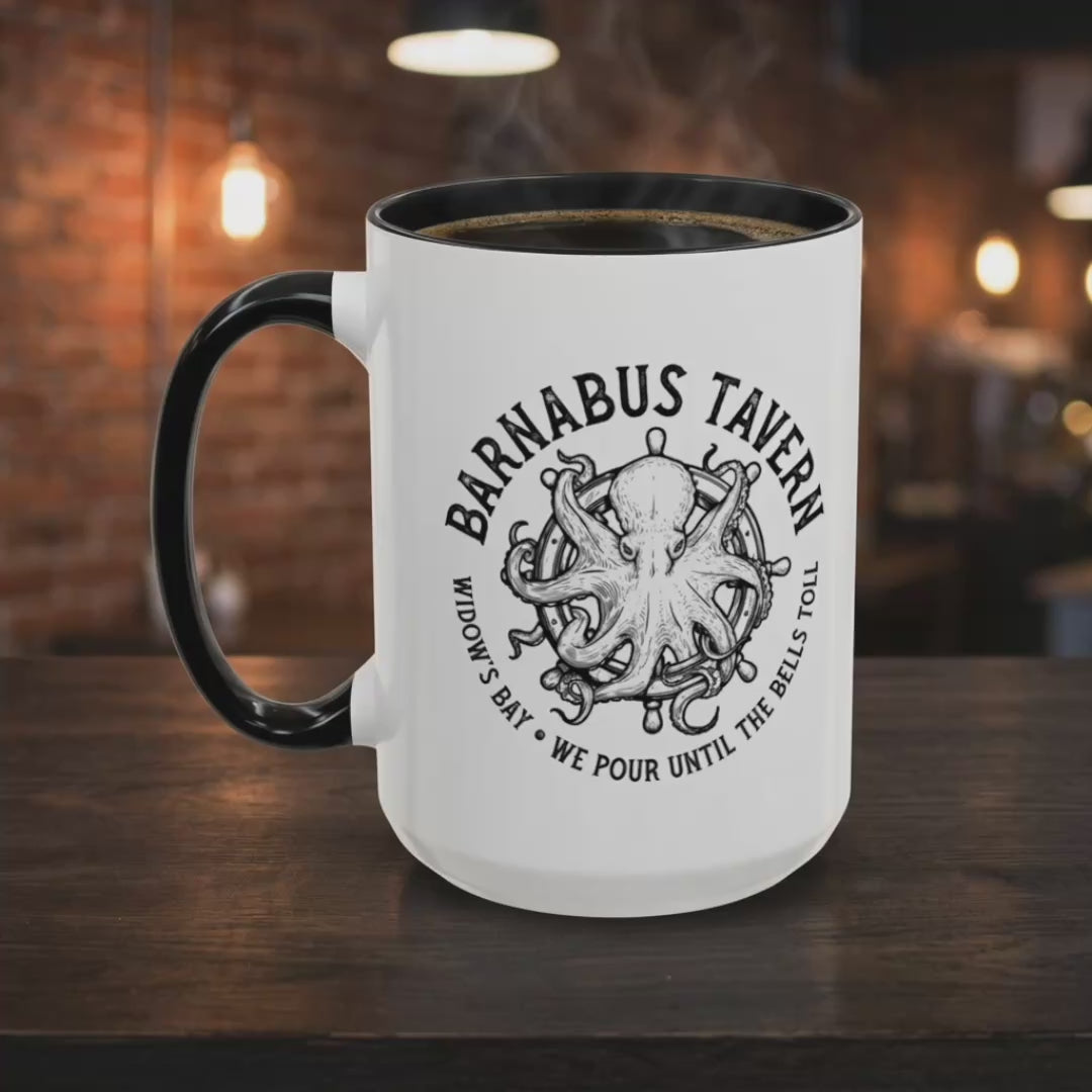 Video of White accent mug with black handle on left and vintage Barnabus Tavern octopus ship's wheel design inspired by Widows Bay, shown in a pub.