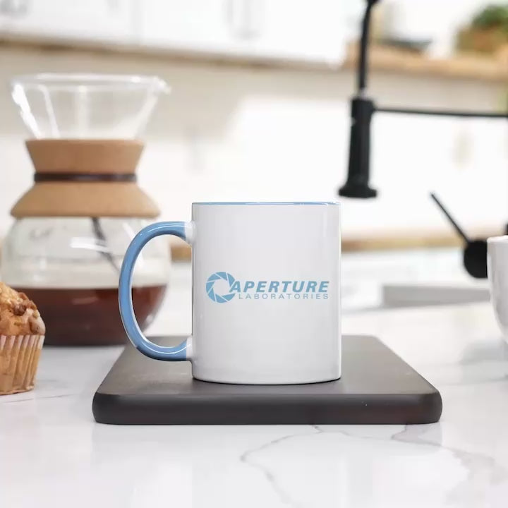 Video of a Mug with blue interior and handle featuring 'Aperture Laboratories' logo.