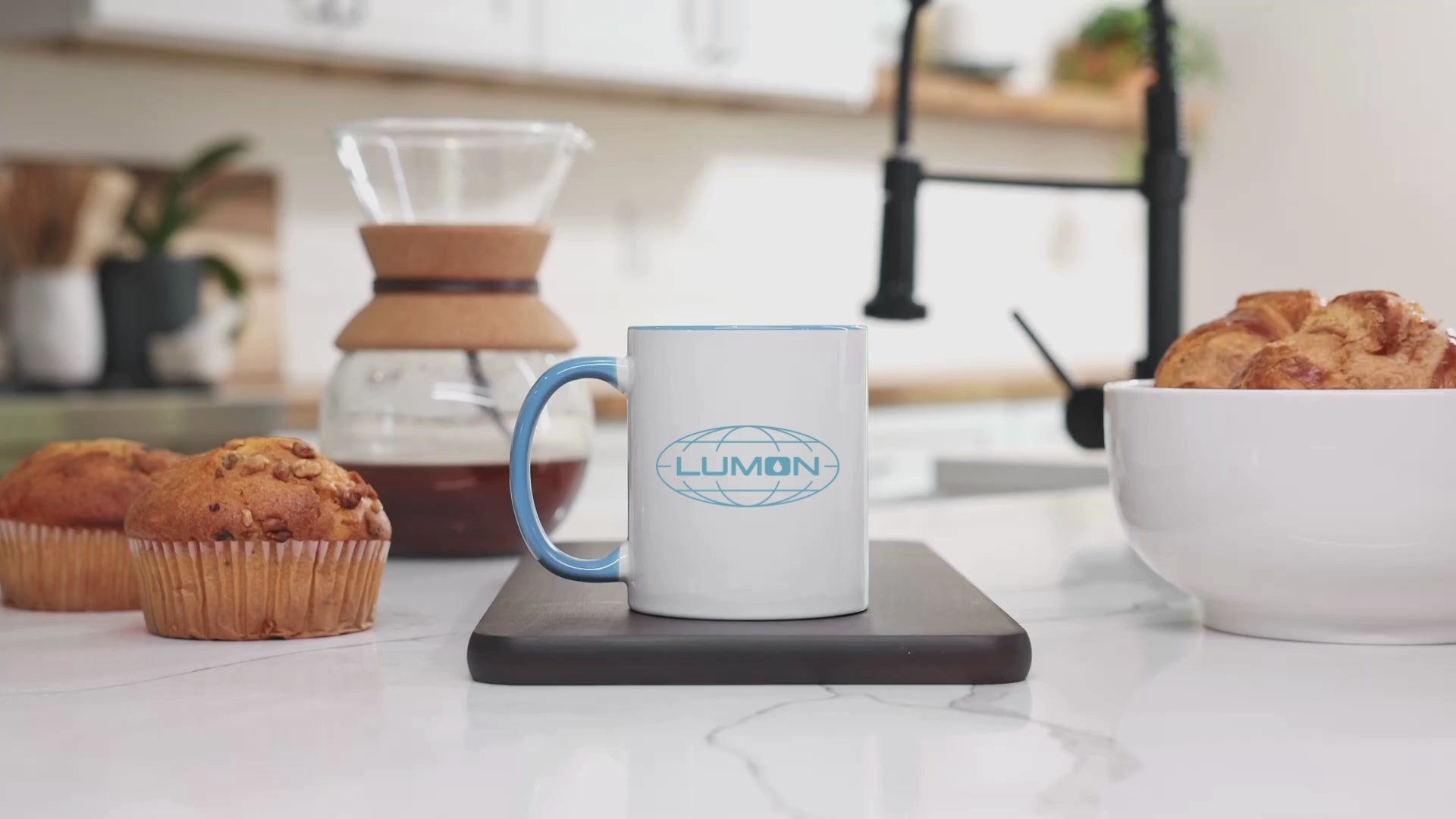 Video of a White Ceramic Mug (11 oz) with the blue Lumon Industries logo on both sides, inspired by the Apple TV show Severance.