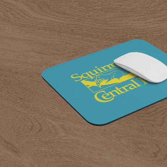 Video of Squirrels Of Central Park mouse pad in gold on blue inspired by Bad Sisters TV show, shown on a wooden desk with a mouse and a computer.