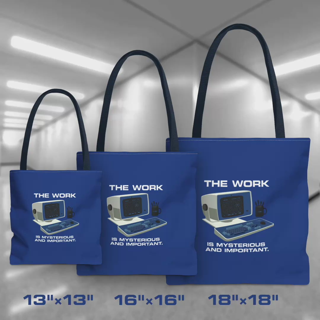 Video of Blue Tote Bags featuring the retro computer workstation from the Apple TV show Severance, and includes the text The Work is Mysterious and Important. Graphic is designed and illustrated by ScriptedBrand, and is available in 3 sizes.