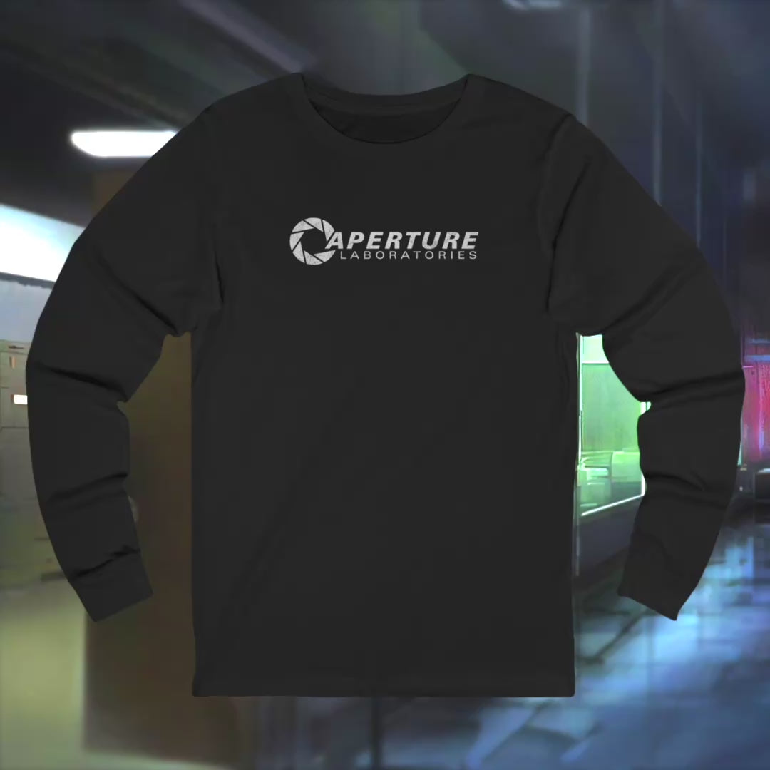 Video of soft long-sleeve t-shirts featuring the Aperture Laboratories logo from the video game Portal and Portal 2 in a vintage distressed style, sold by ScriptedBrand. 