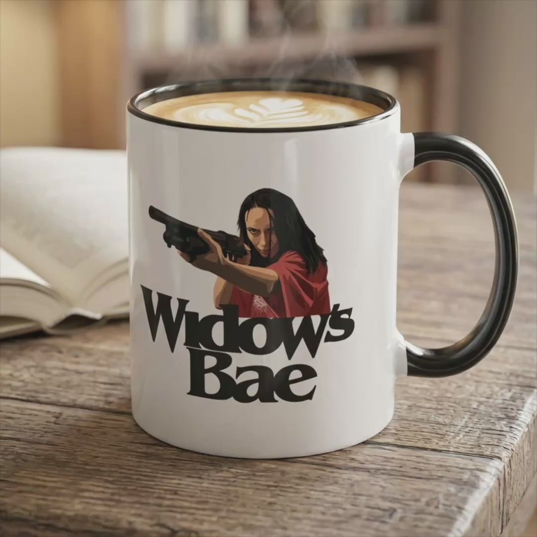 Video of White ceramic mug with black handle and the vintage Salty Whale maritime crest logo from Widow's Bay TV show, on a table