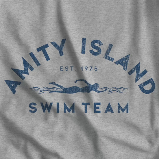 Video of tee with vintage distressed Amity Island Swim Team Jaws-inspired swimmer logo
