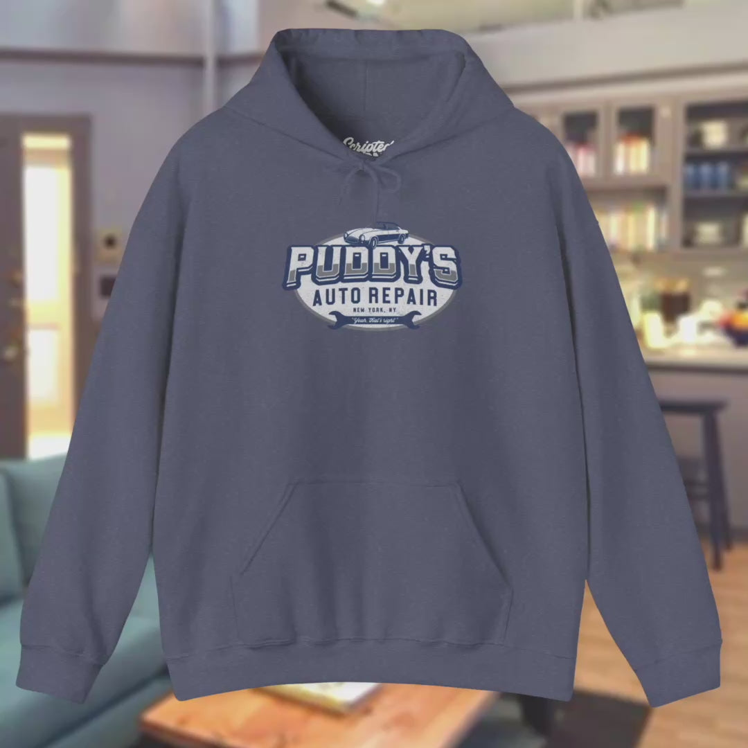 Video of soft Unisex Hoodie Heavy Blend Hooded Sweatshirts featuring a Puddy's Auto Repair graphic designed by ScriptedBrand inspired by the TV show Seinfeld in a vintage distressed style.
