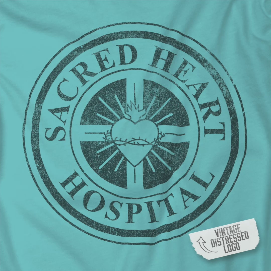 Video of Bella Canvas 3001 tee with distressed Sacred Heart Hospital logo from Scrubs printed on chest.