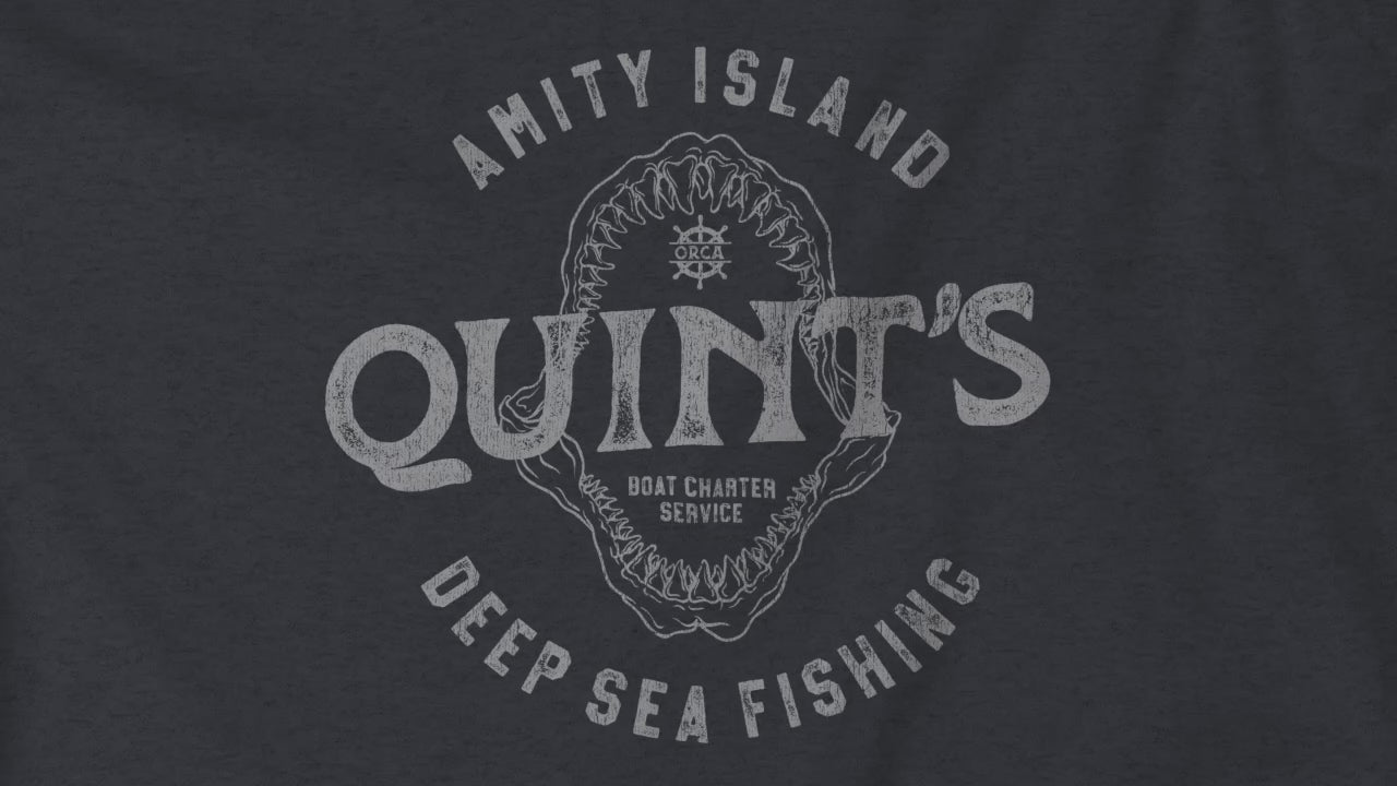 Video closeup vintage Quint’s Deep Sea Fishing logo from Jaws, printed on heather navy fabric.