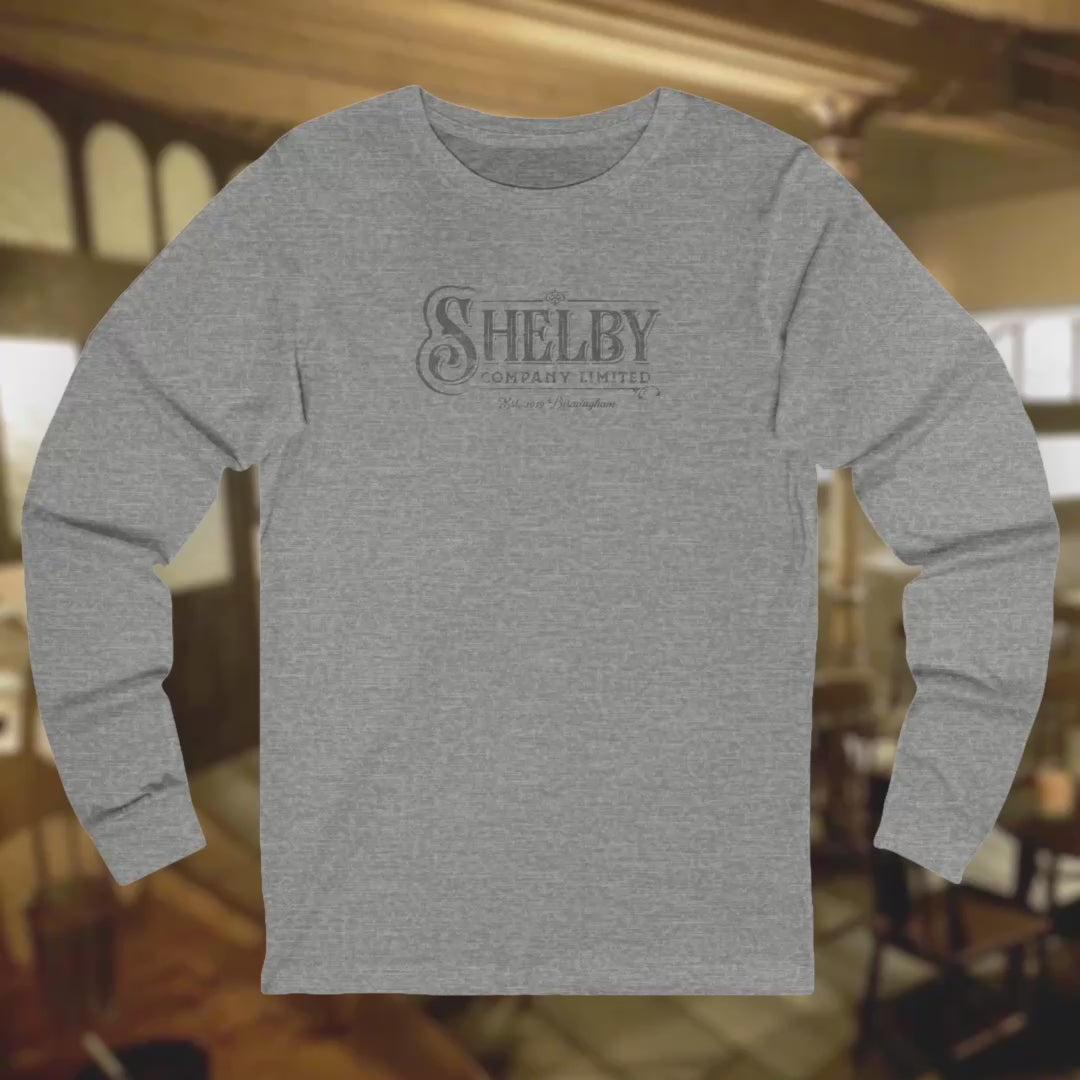 Video of soft unisex Bella-Canvas 3501 long-sleeve t-shirts featuring the Shelby Company Limited logo from the show Peaky Blinders in a vintage distressed style, sold by ScriptedBrand.
