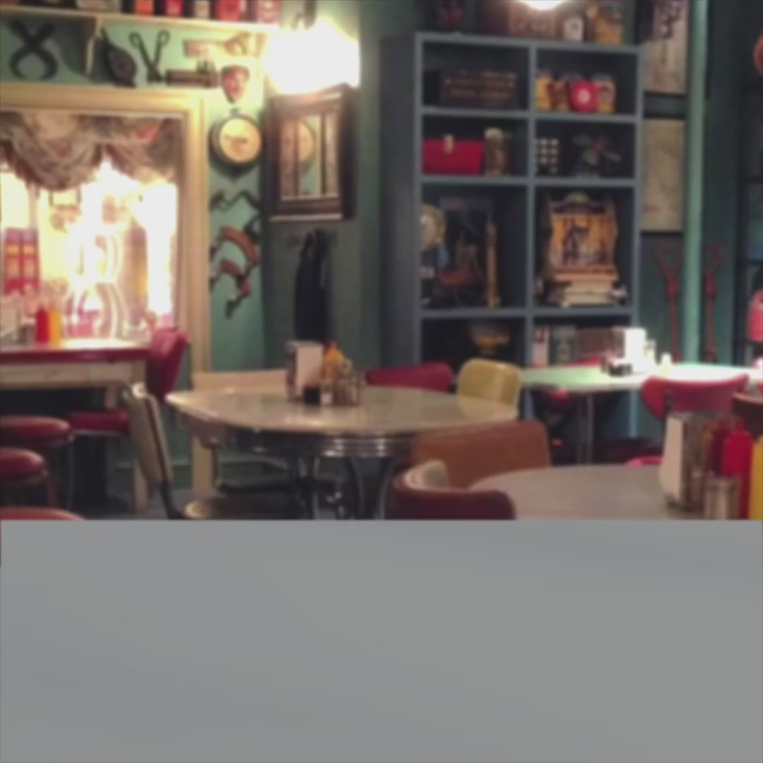 Video of 15 and 11 oz White ceramic mugs with yellow handle and Luke’s Diner logo from Gilmore Girls printed on both sides.