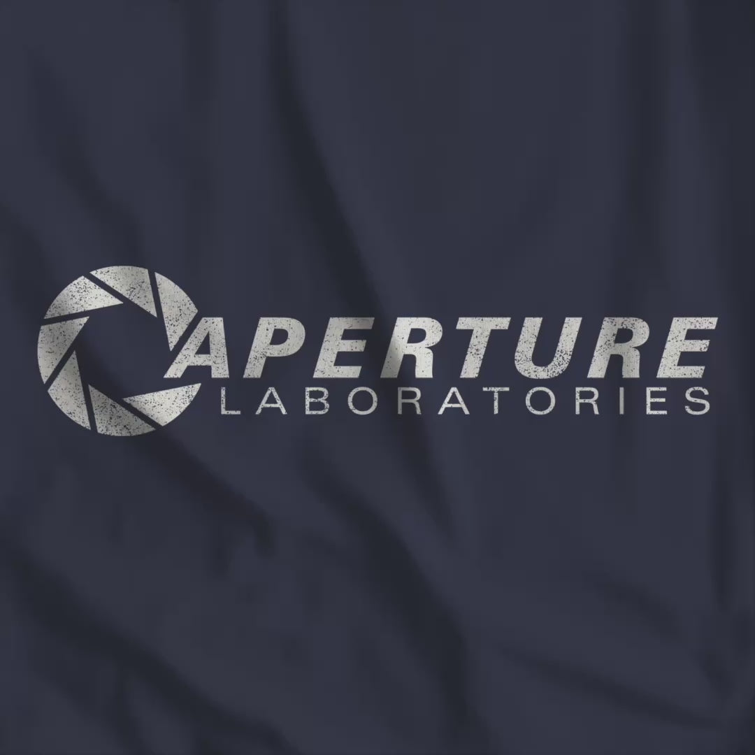 Video of Bella Canvas t-shirt with the Aperture Laboratories logo from the video game Portal and Portal 2 in a vintage distressed style.