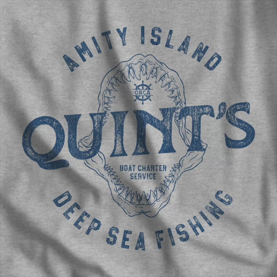 Video of t-shirt featuring the Quint's Deep Sea Fishing Boat Charters logo graphic inspired by the movie Jaws in a vintage distressed style.