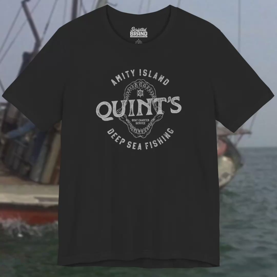 Video featuring Soft short-sleeve t-shirts featuring the Quint's Deep Sea Fishing Boat Charters logo graphic inspired by the movie Jaws in a vintage distressed ink-stamped worn-in style.